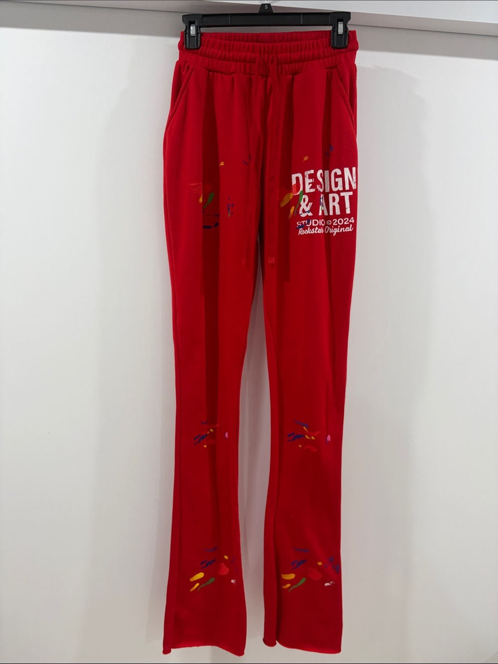 Design & Art Red Track Joggers with Paint-Splatter Detail